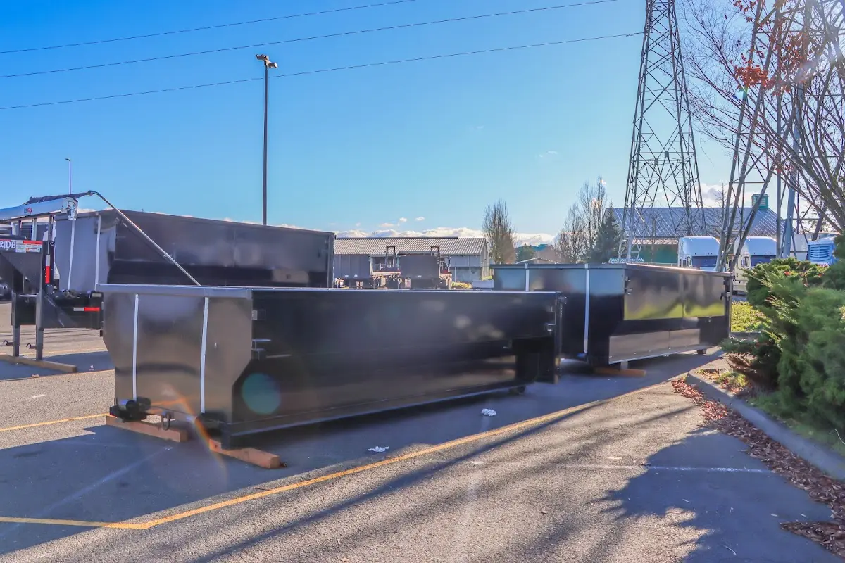 Roll-off dumpster ready for waste disposal at job site for Cleanout Dumpster Rental in West Little River